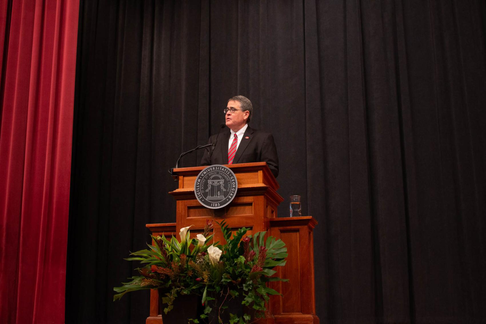 President Jere Morehead standing at a podium speaking